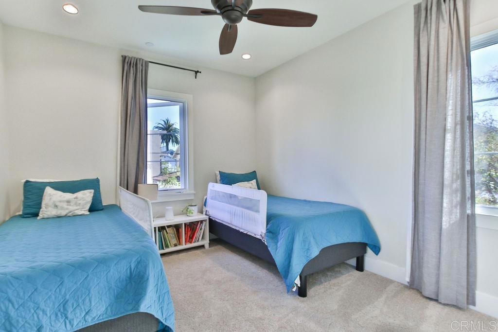 573 H Coronado, CA 92118 - Photo 35 of 39 a bedroom with a bed and window