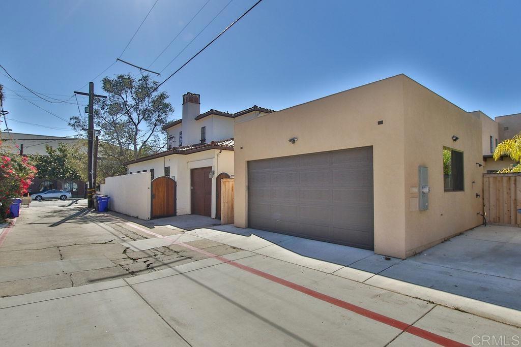 573 H Coronado, CA 92118 - Photo 38 of 39 a front view of a house with a garage
