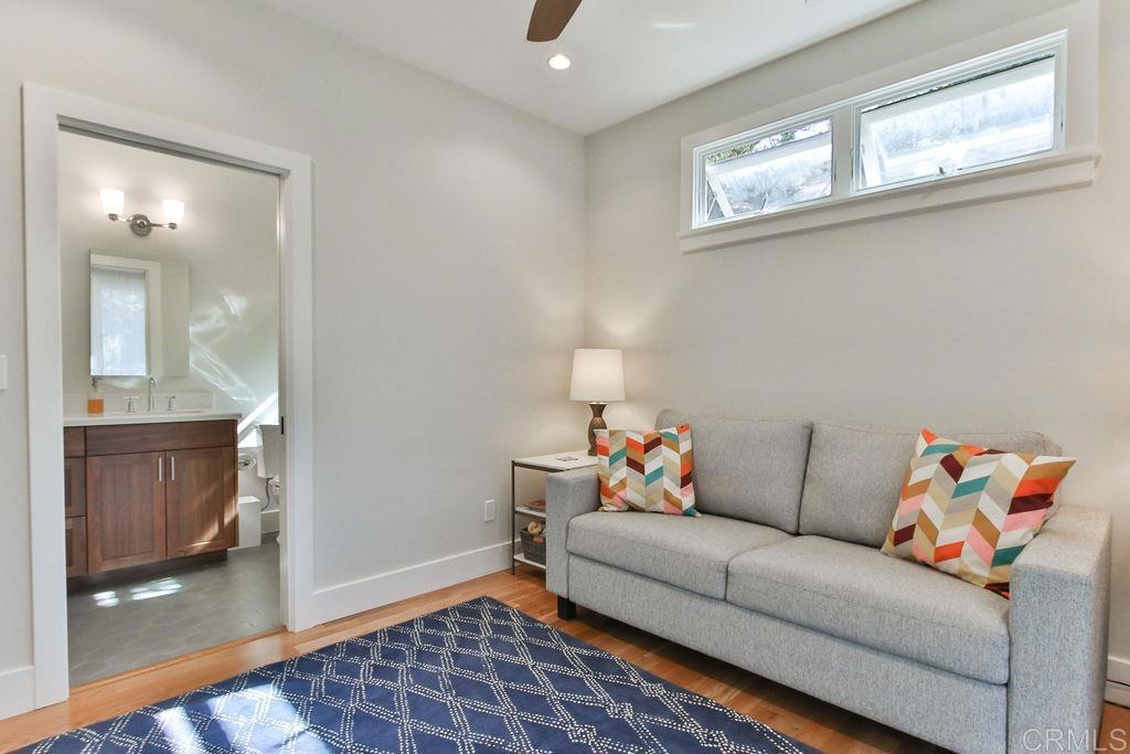 573 H Coronado, CA 92118 - Photo 8 of 39 a living room with furniture and a window