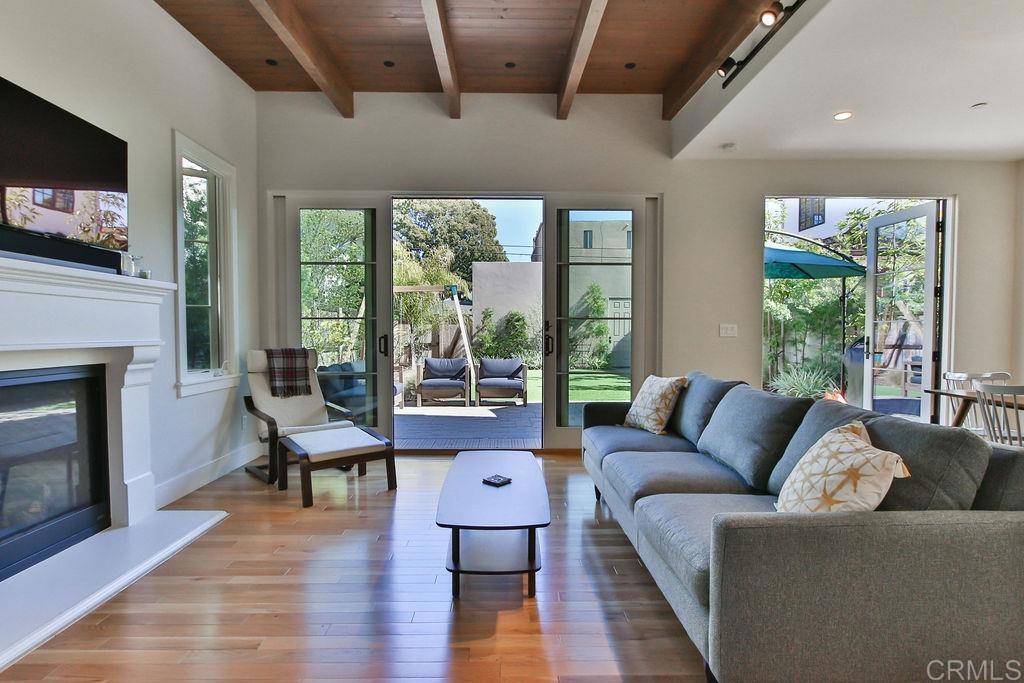 573 H Coronado, CA 92118 - Photo 10 of 39 a living room with furniture and a fireplace