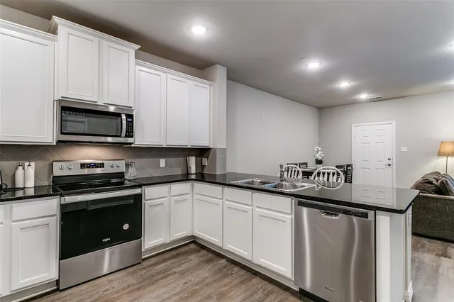 a front view of a stone house with a yard