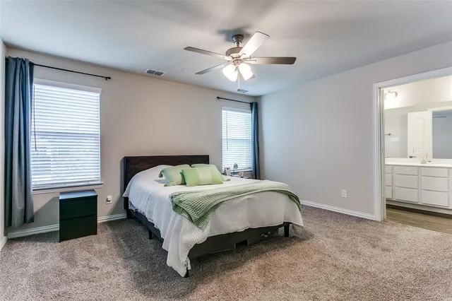 a kitchen with stainless steel appliances granite countertop a sink a stove and cabinets
