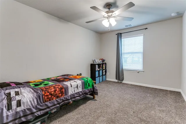 a view of a livingroom with furniture and a window