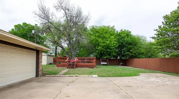 a front view of a house with a yard and a garage