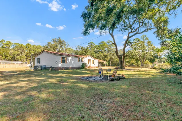 a view of a backyard with trees