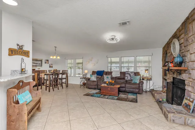 a living room with furniture and a table