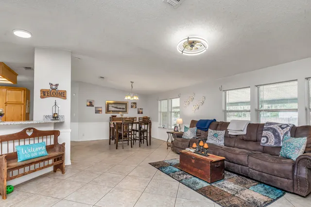a view of a dining room with furniture window and outside view