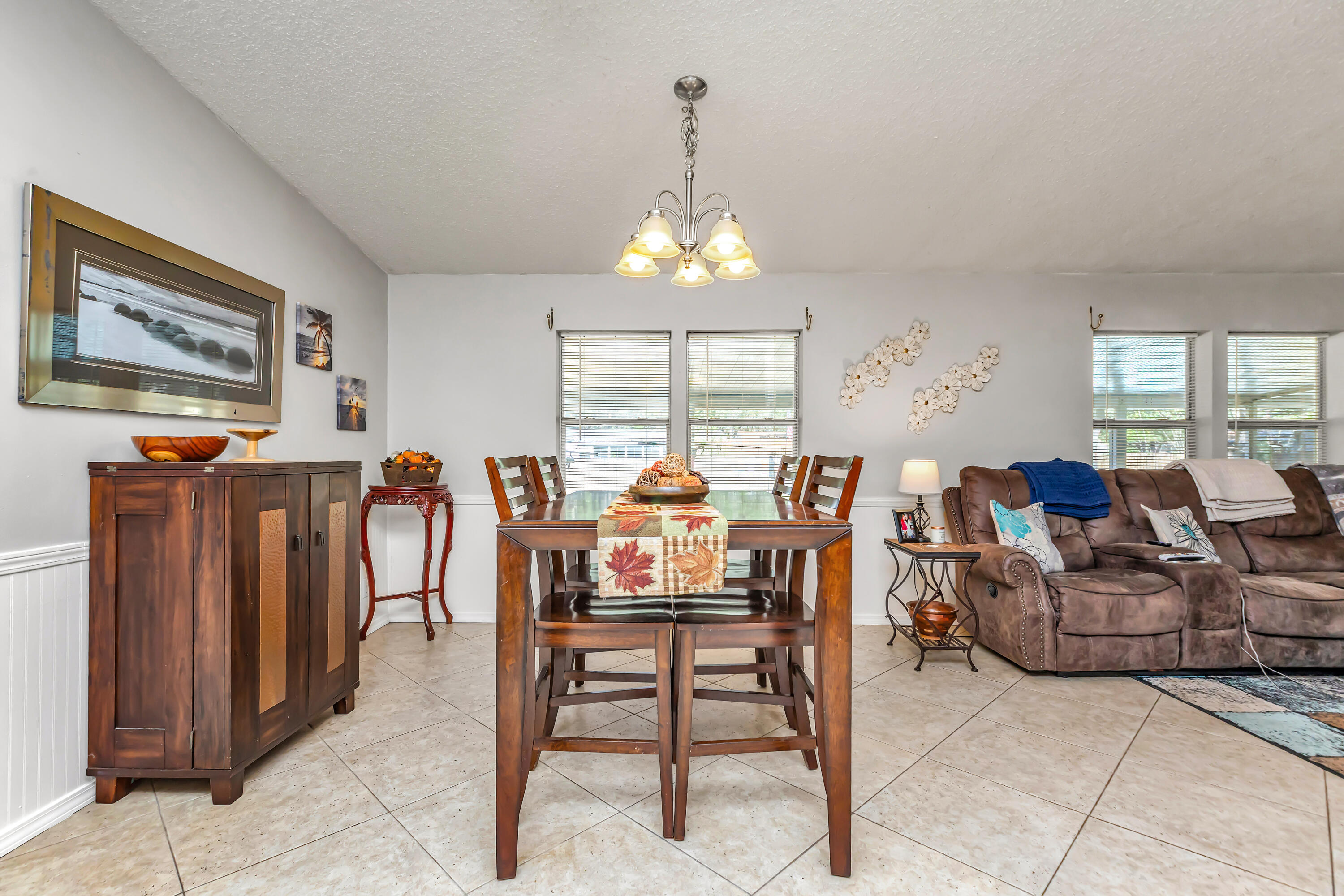7478 Rose Street Navarre, FL 32566 - Photo 24 of 60 a view of a dining room with furniture window and outside view