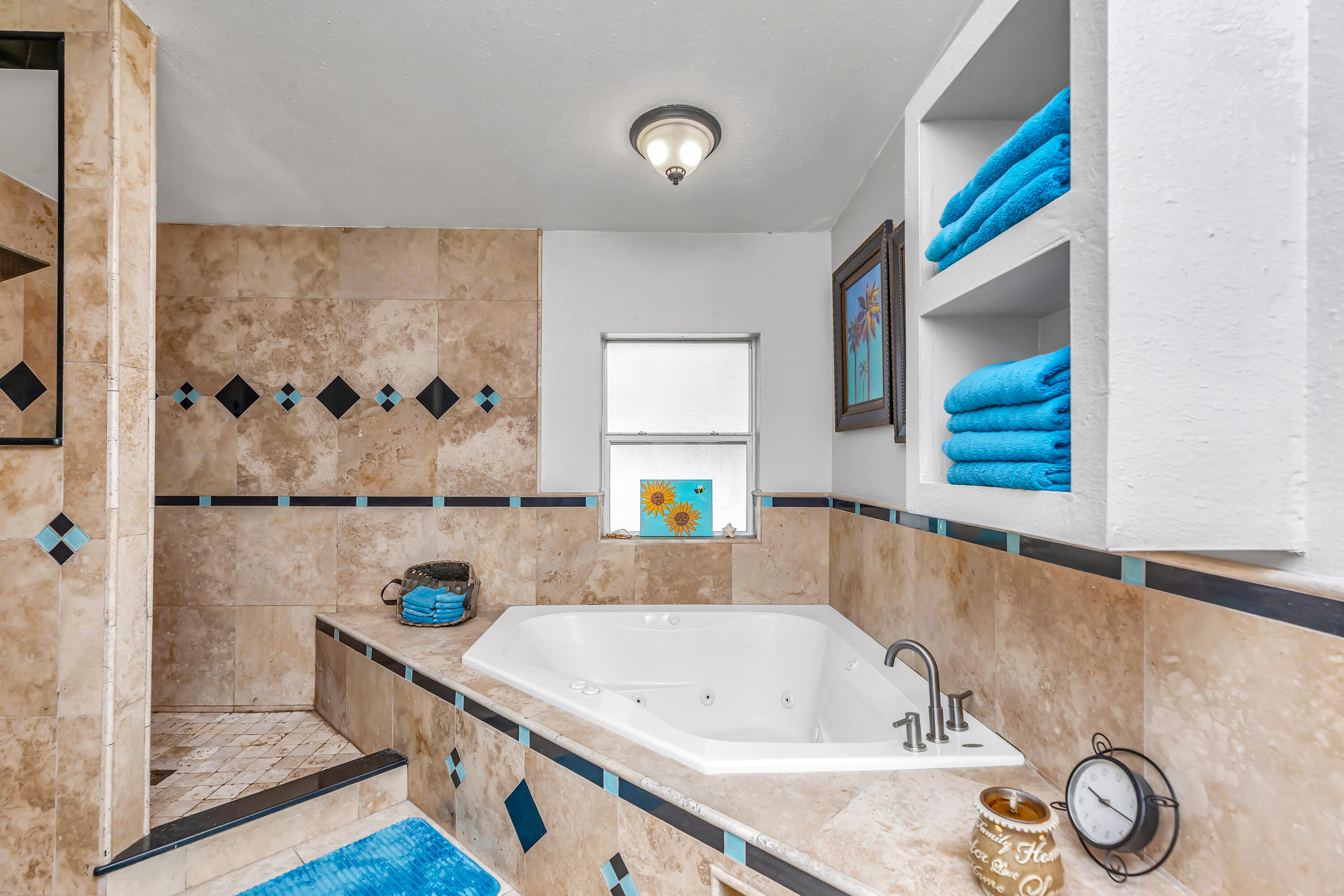 7478 Rose Street Navarre, FL 32566 - Photo 33 of 60 a bathroom with a tub and a shower