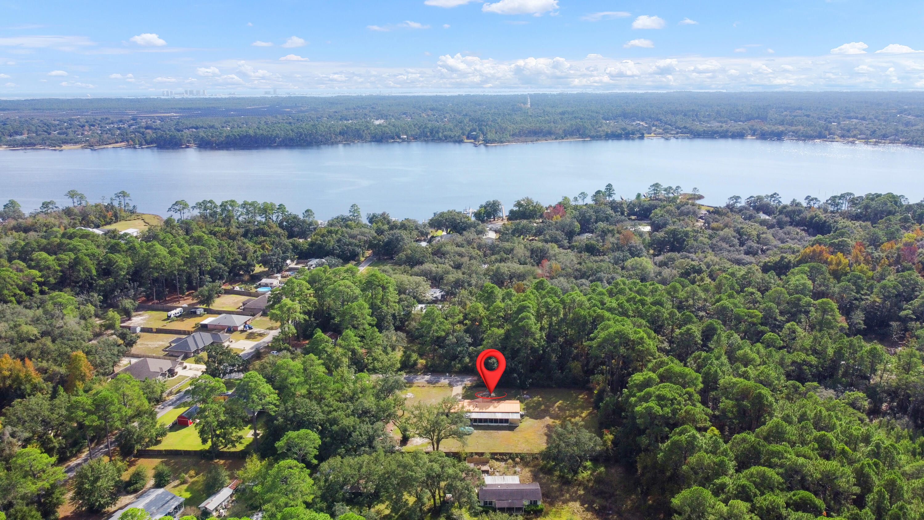 7478 Rose Street Navarre, FL 32566 - Photo 54 of 60 a view of a lake from a yard