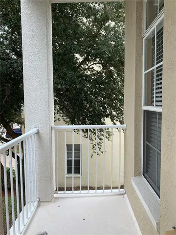 a view of house with a tree