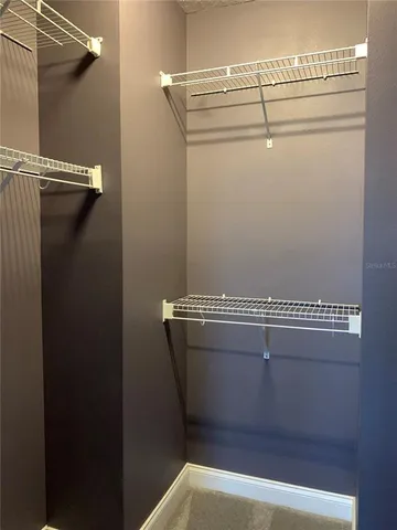 a view of a room with racks on the wall