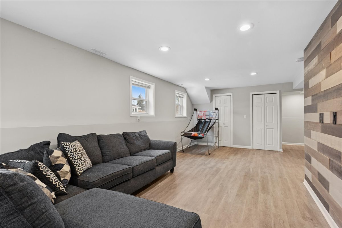 128 McCabe Drive Streamwood, IL 60107 - Photo 16 of 19 a living room with furniture and a wooden floor