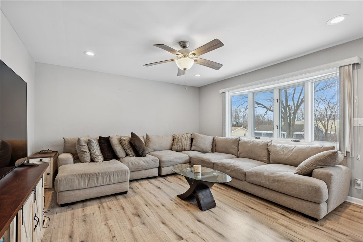 128 McCabe Drive Streamwood, IL 60107 - Photo 4 of 19 a living room with furniture and a large window