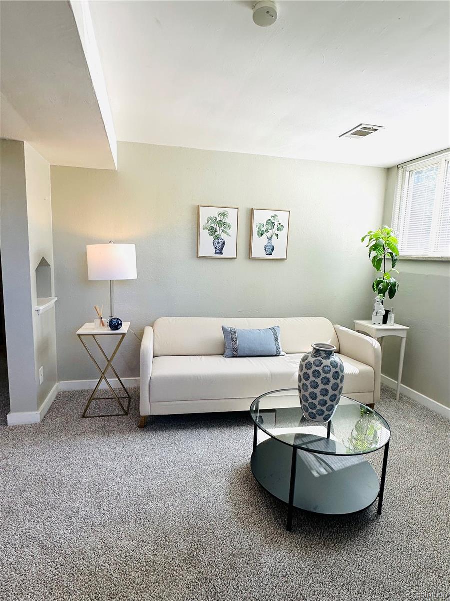 1400 South Clermont Street, Unit 7 Denver, CO 80222 - Photo 12 of 20 a living room with furniture and a potted plant