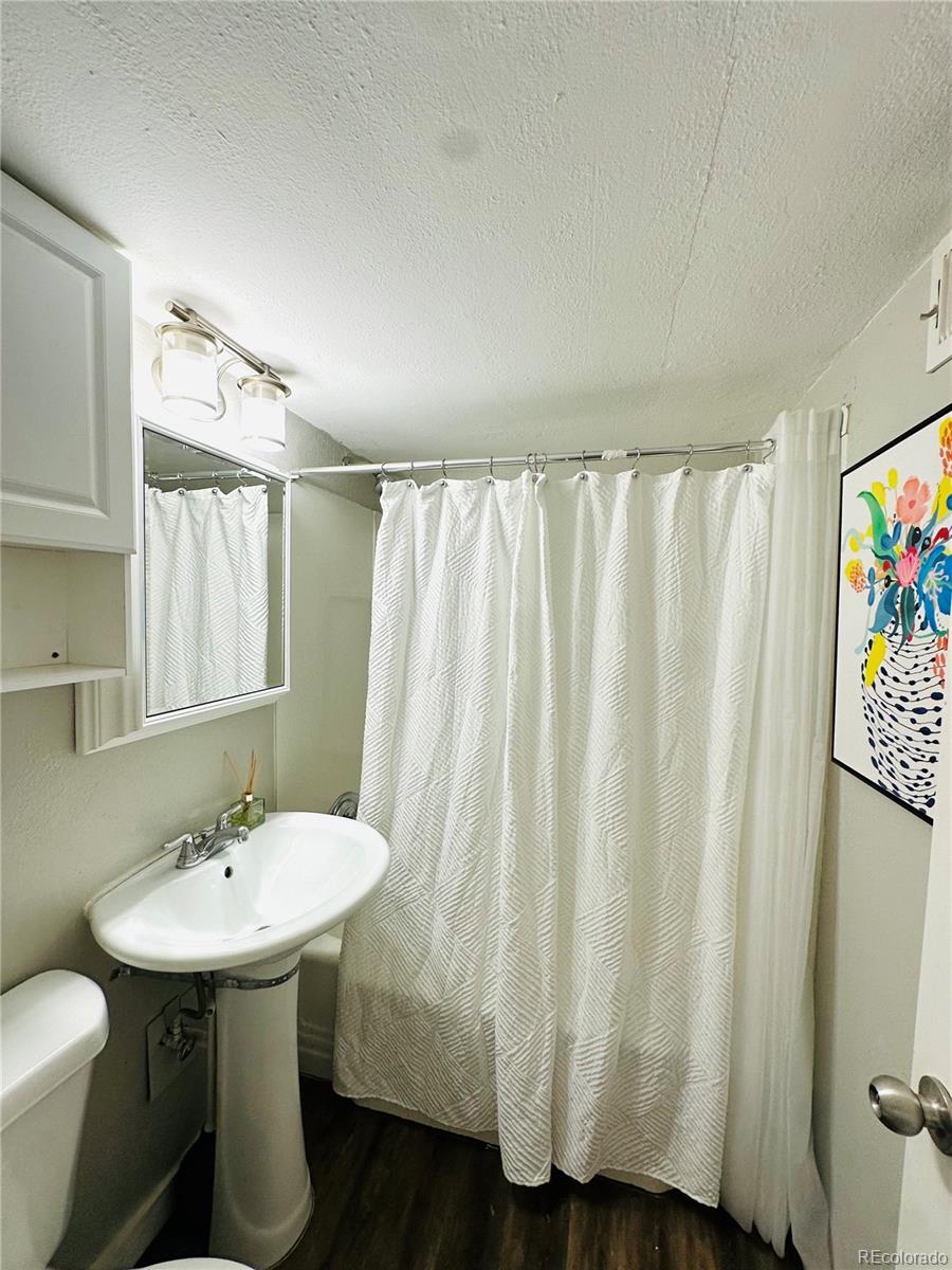 1400 South Clermont Street, Unit 7 Denver, CO 80222 - Photo 18 of 20 a bathroom with a sink toilet and shower