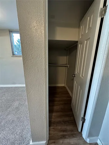 a view of staircase with wooden floor and staircase