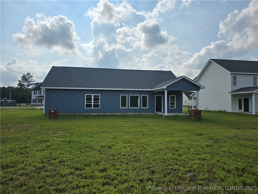 102 Sunny Acres Lane Clinton, NC 28328 - Photo 17 of 17 a front view of a house with garden