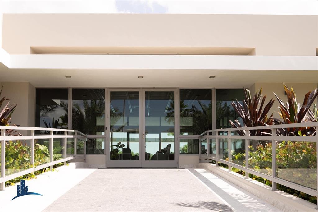 71 Ace Bayamon, PR 00959 - Photo 16 of 19 a view of a building with floor to ceiling windows and a basket ball poll