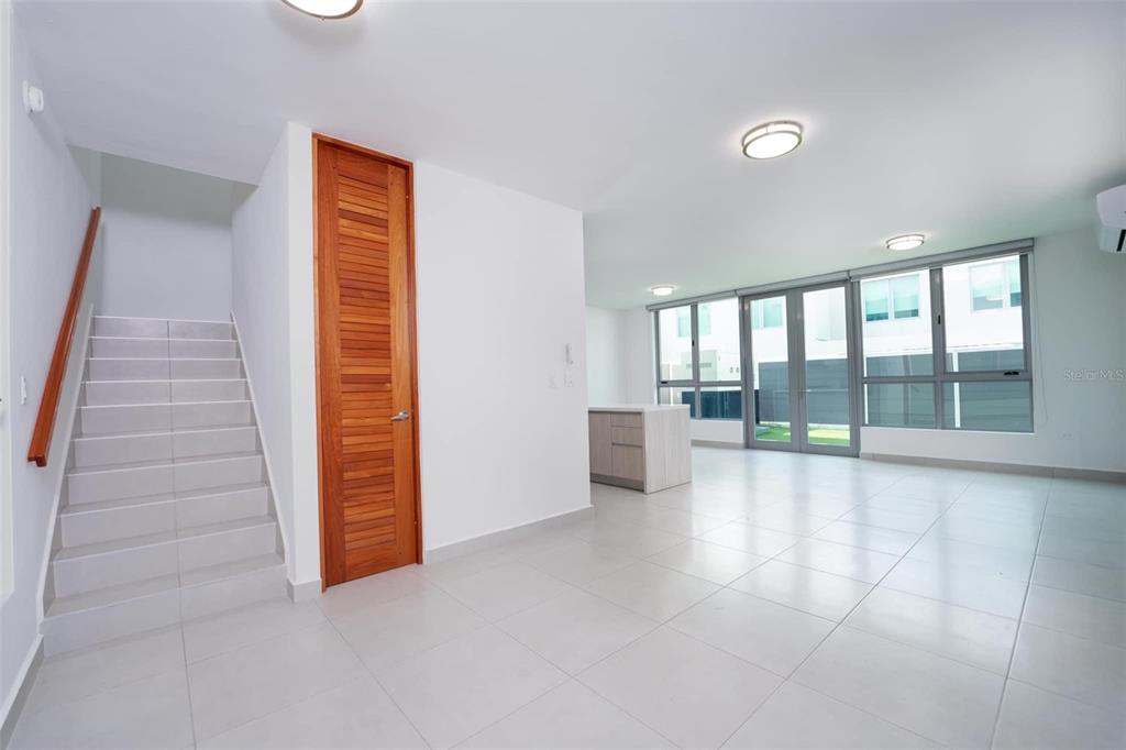 71 Ace Bayamon, PR 00959 - Photo 6 of 19 an empty room with windows and mirrors