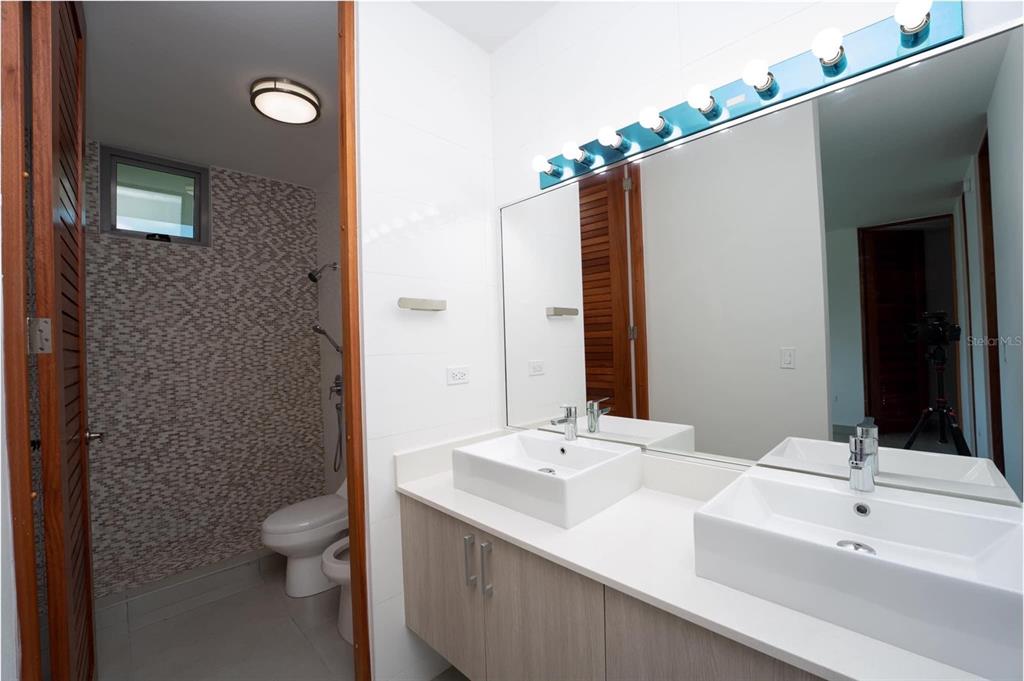71 Ace Bayamon, PR 00959 - Photo 7 of 19 a bathroom with a sink a toilet and shower