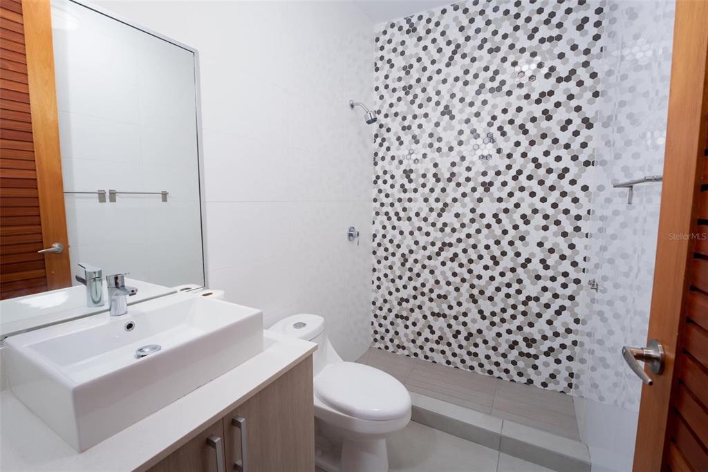 71 Ace Bayamon, PR 00959 - Photo 8 of 19 a bathroom with a sink toilet and shower