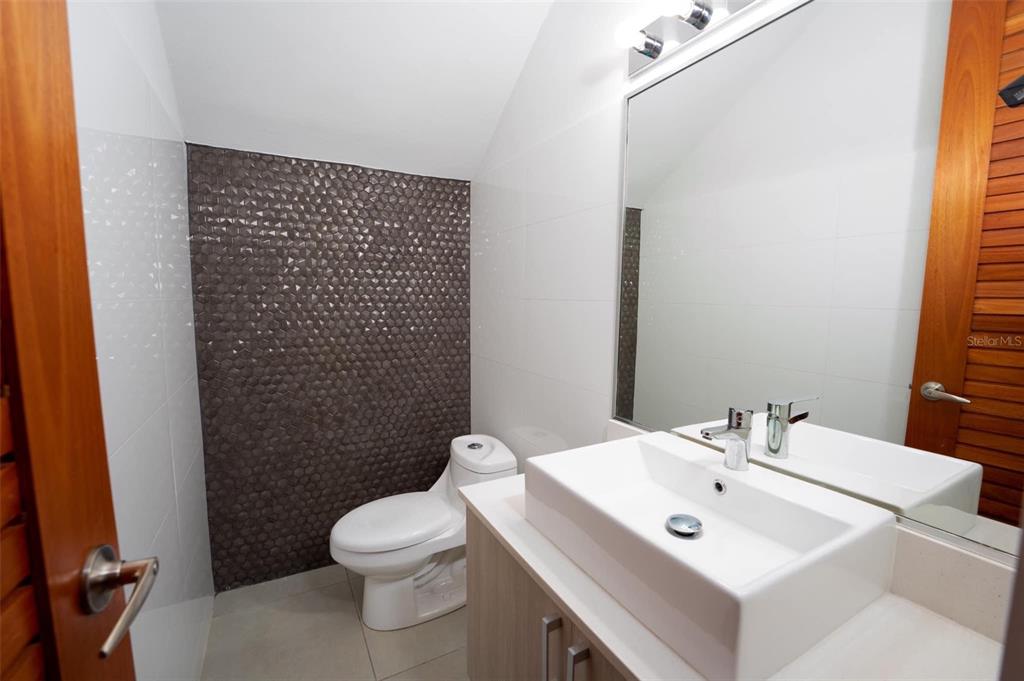 71 Ace Bayamon, PR 00959 - Photo 9 of 19 a bathroom with a sink toilet and mirror