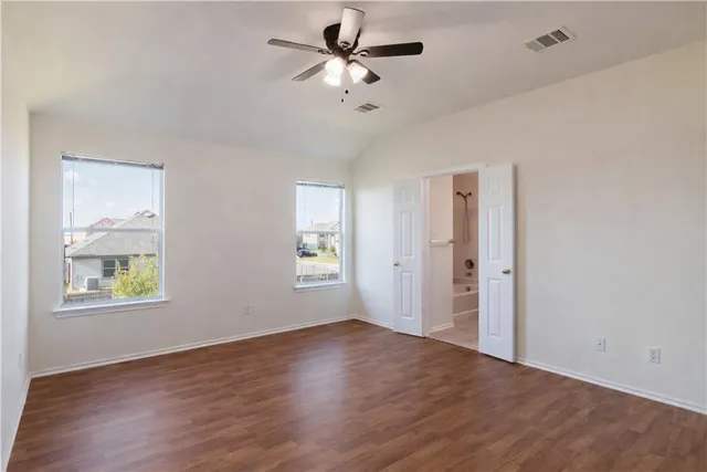 a view of an empty room with a window