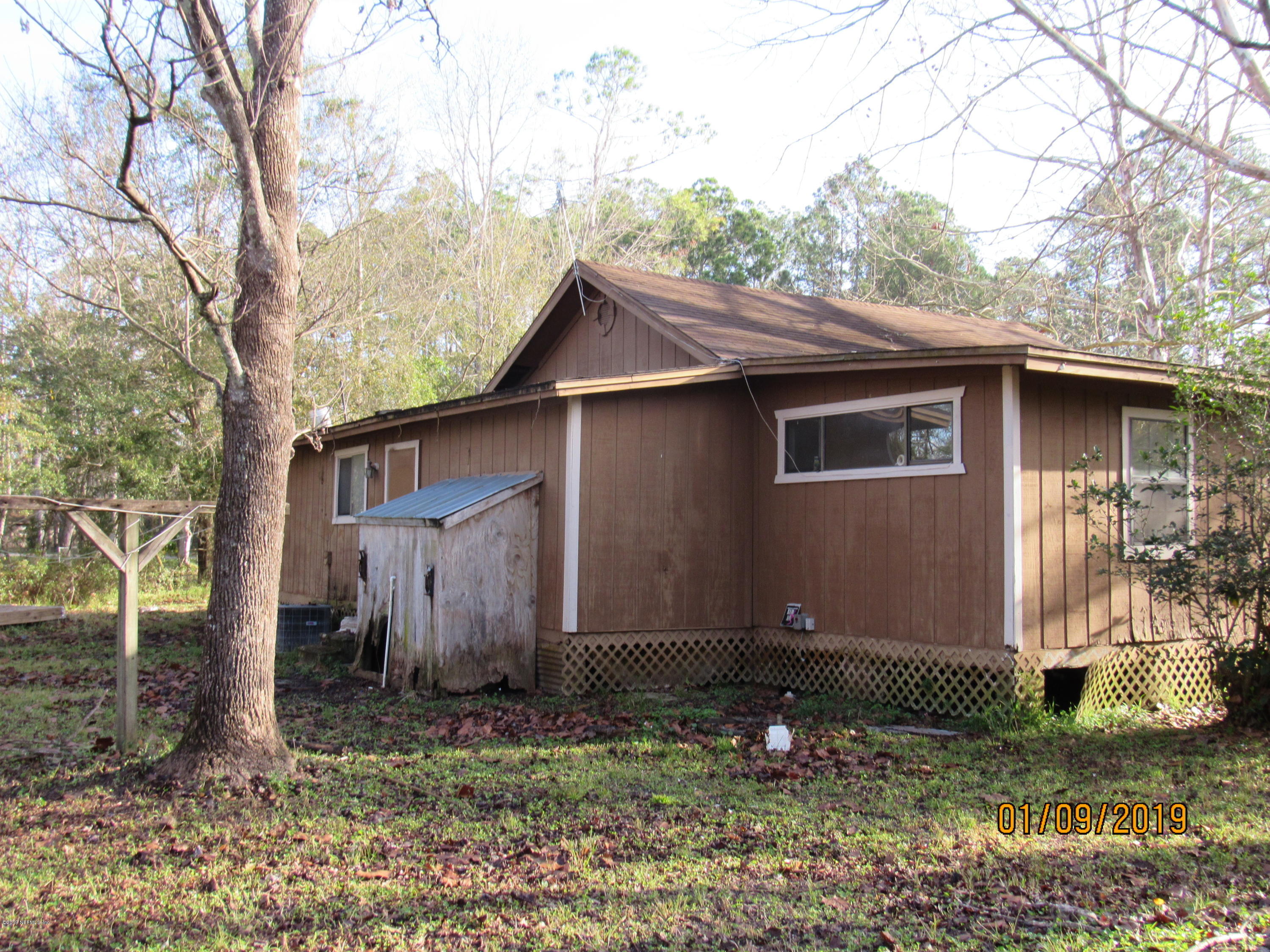1578 Baxley Road Middleburg, FL 32068 - Photo 4 of 9 a backyard of a house with lots of green space
