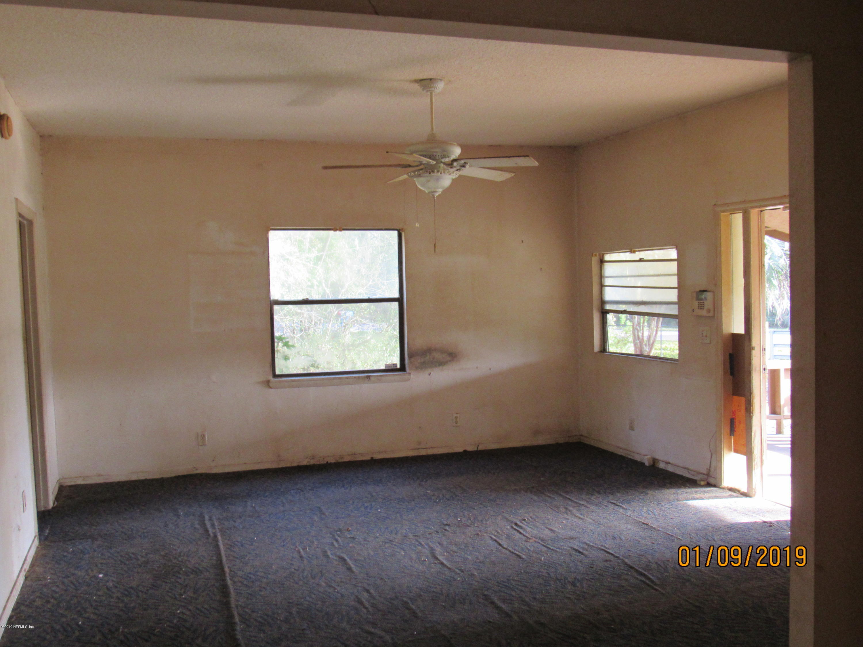 1578 Baxley Road Middleburg, FL 32068 - Photo 9 of 9 an empty room with a window and ceiling fan