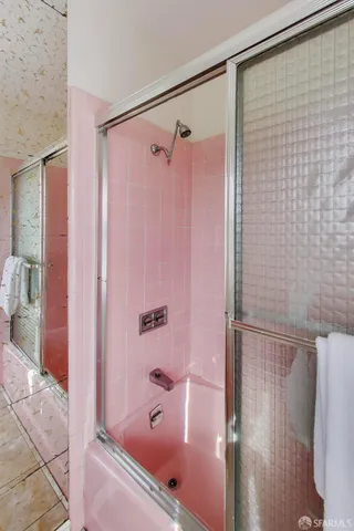 a bathroom with a shower and a tub