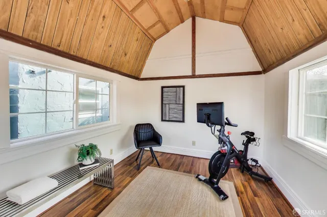 a bedroom with furniture and a window