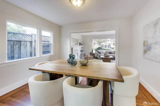 a view of a dining room with furniture and window