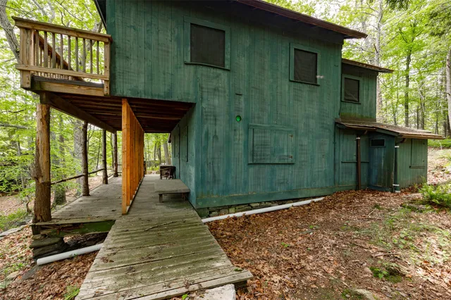 a view of outdoor space with wooden floor and iron stairs