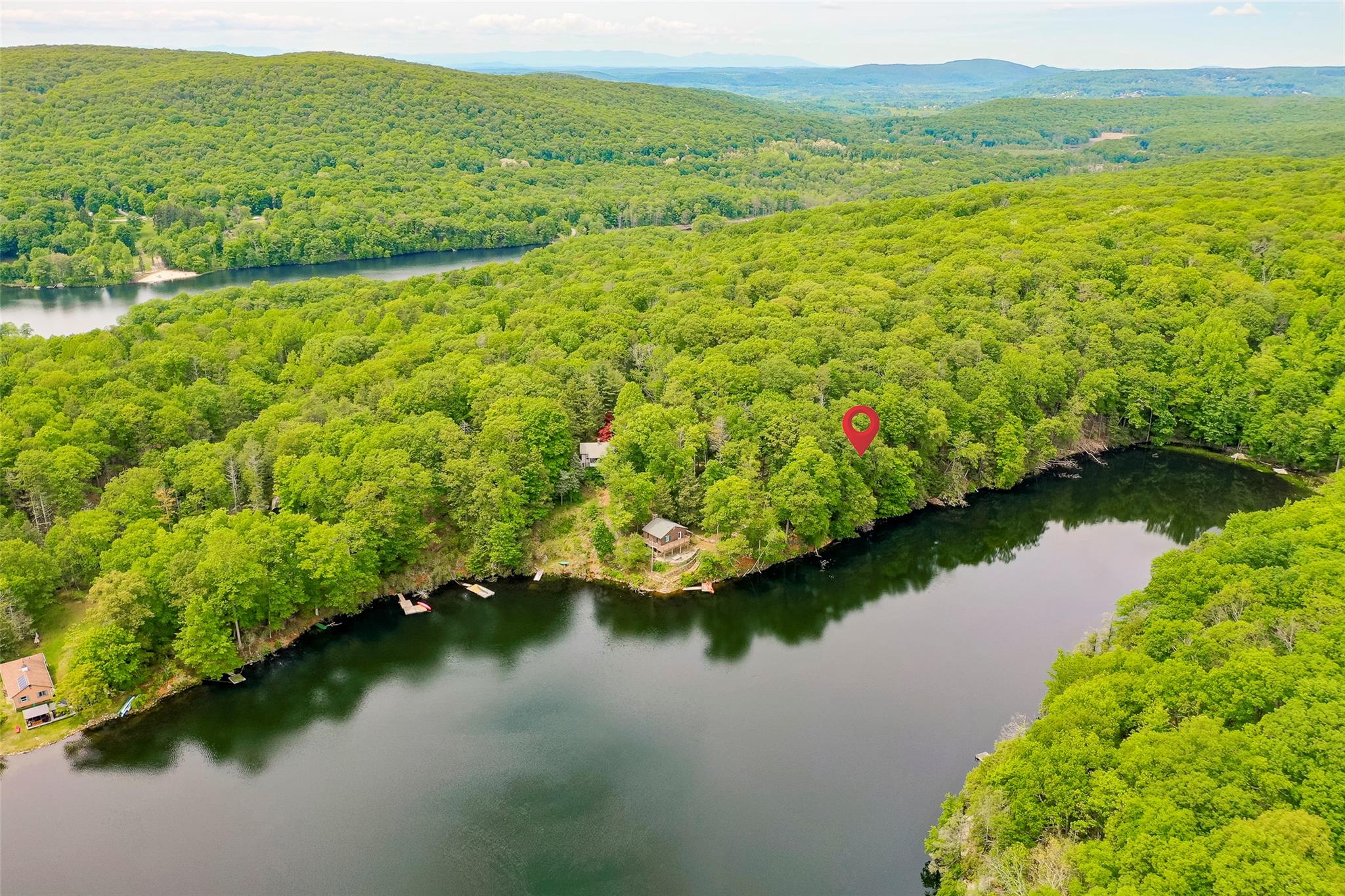 215 Little Pond Road Pawling, NY 12531 - Photo 8 of 24 a view of a lake with a city