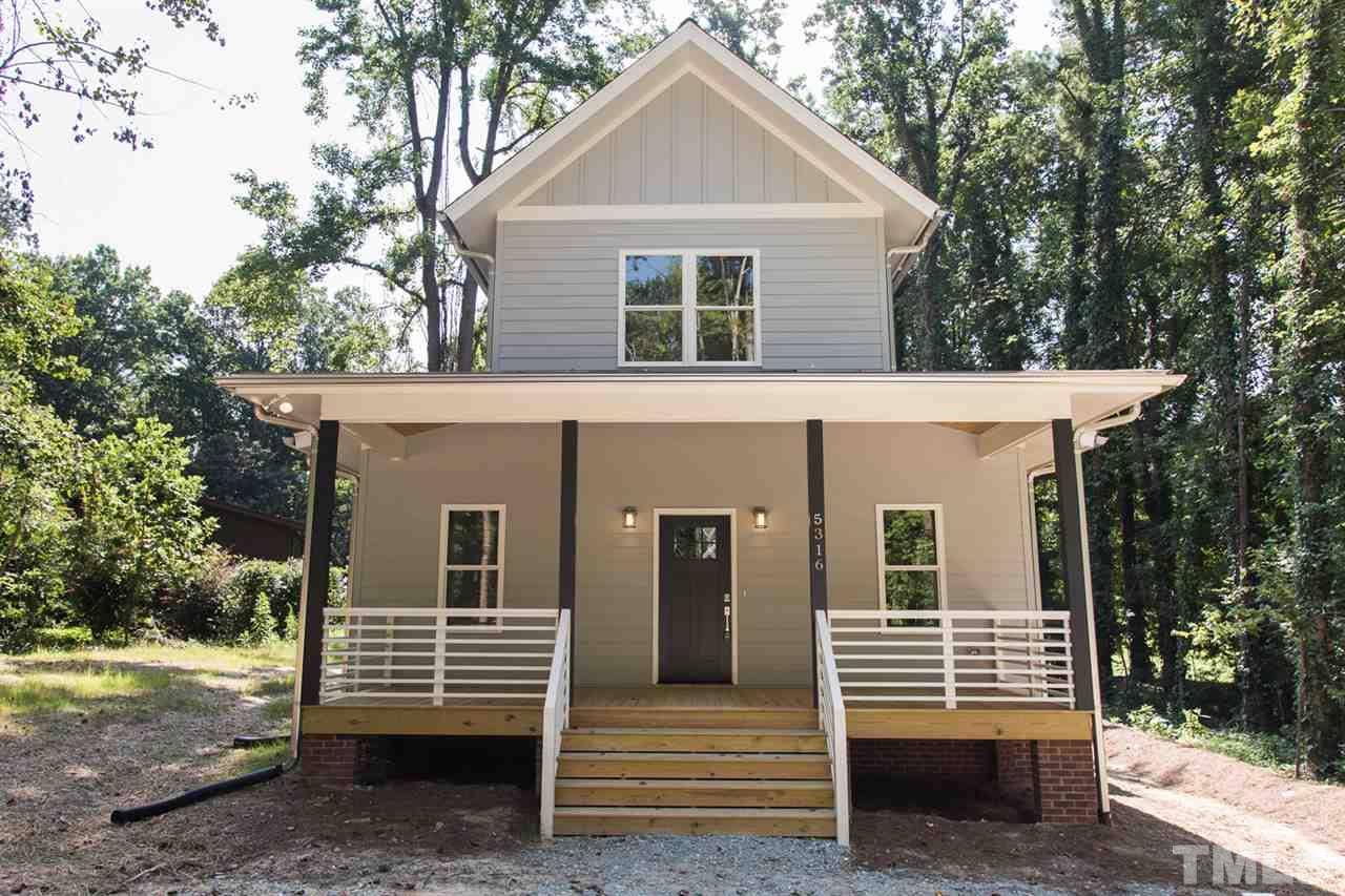 5316 Russell Road Durham, NC 27712 - Photo 1 of 25 a front view of a house with a yard
