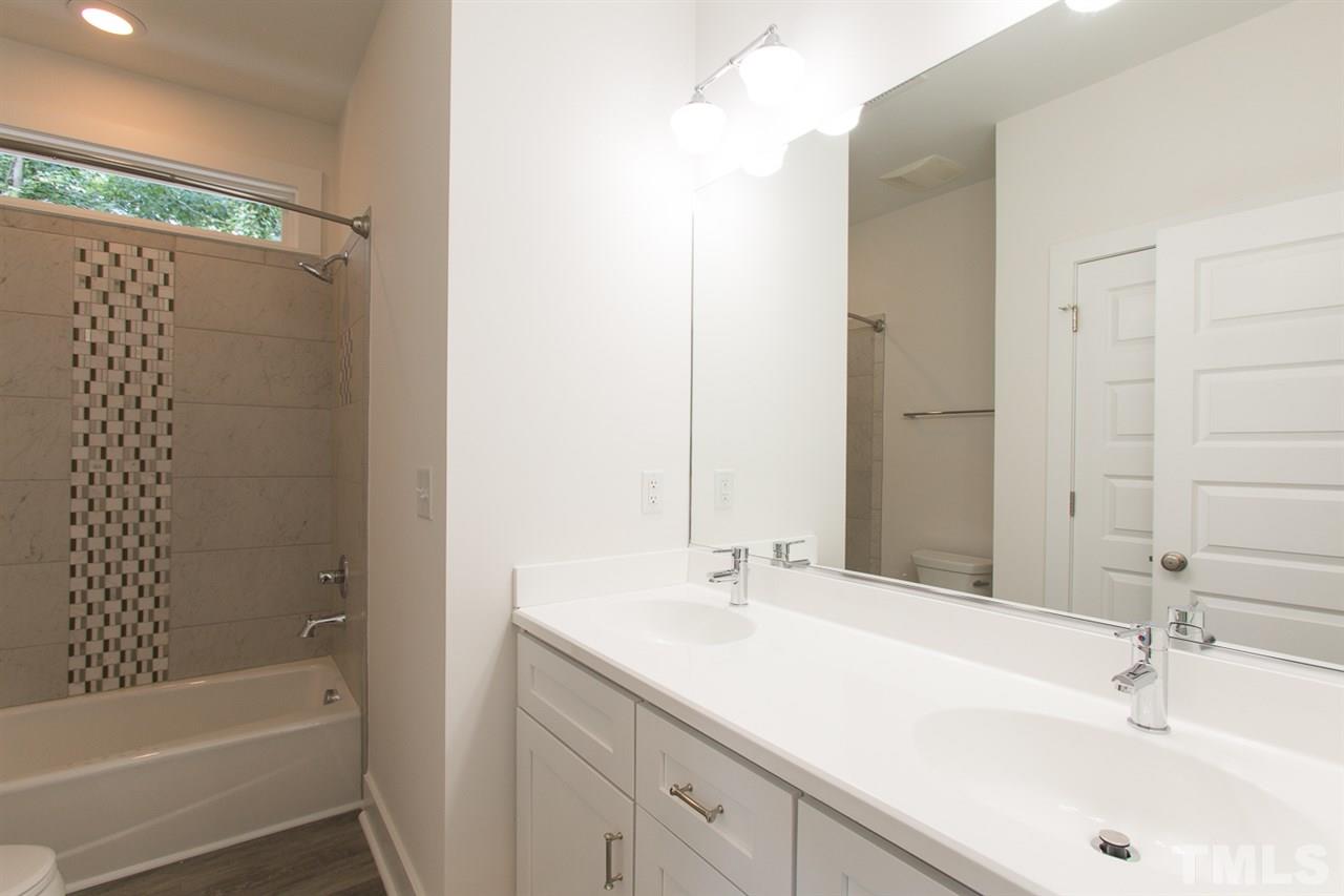 5316 Russell Road Durham, NC 27712 - Photo 17 of 25 a bathroom with a sink and a bathtub