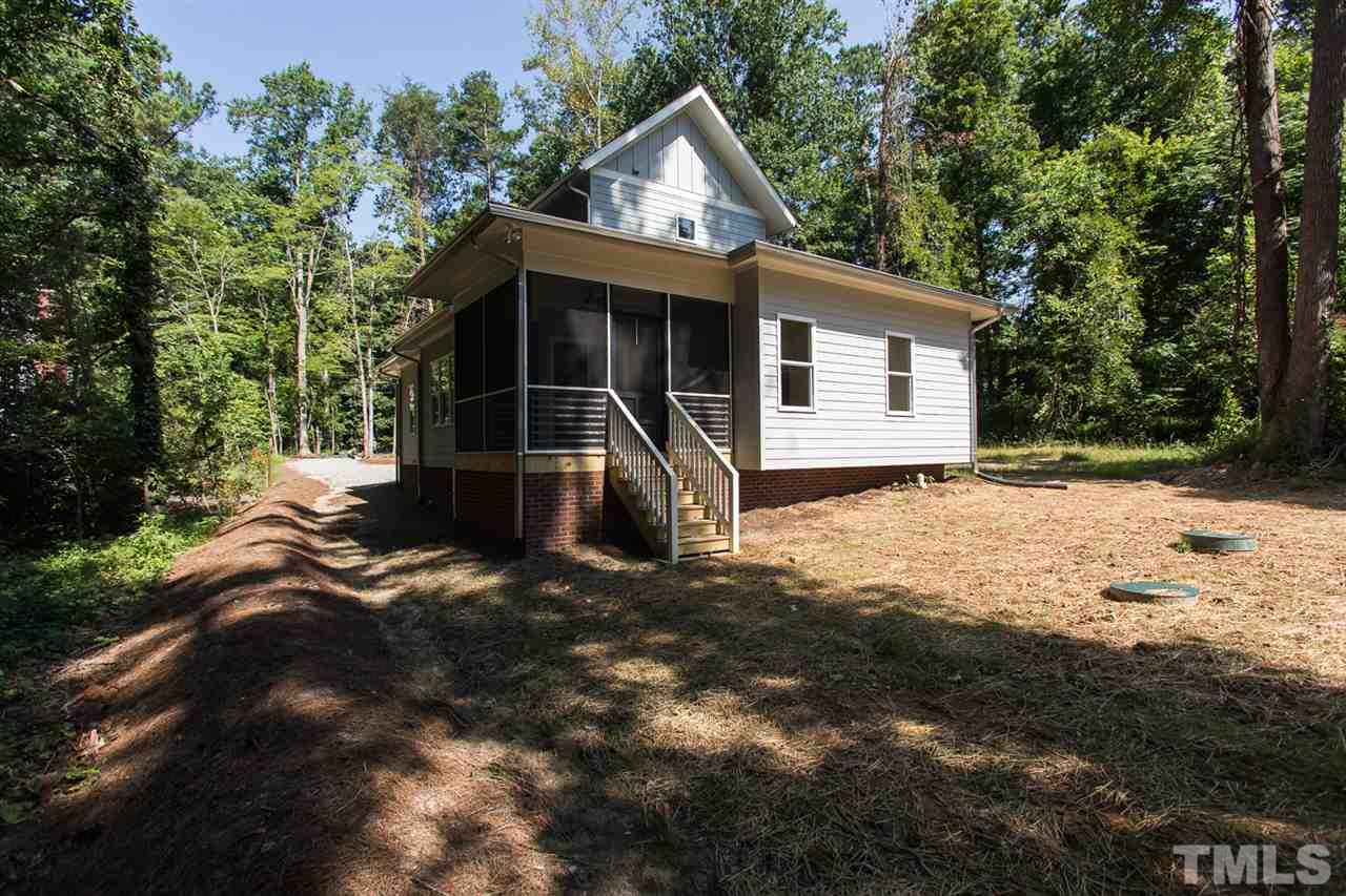 5316 Russell Road Durham, NC 27712 - Photo 21 of 25 a view of a house with a yard and large tree