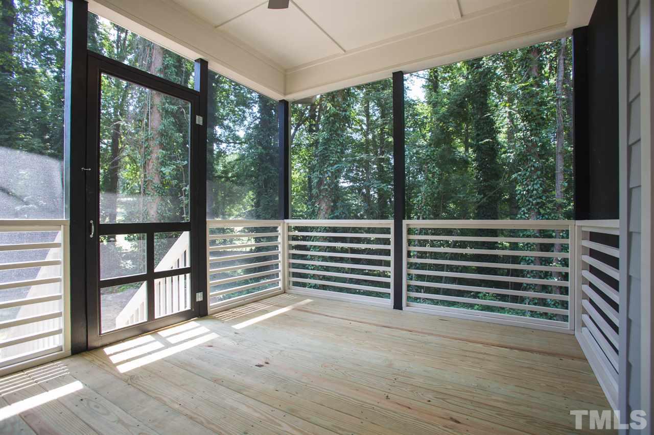 5316 Russell Road Durham, NC 27712 - Photo 22 of 25 a view of a balcony with floor to ceiling windows