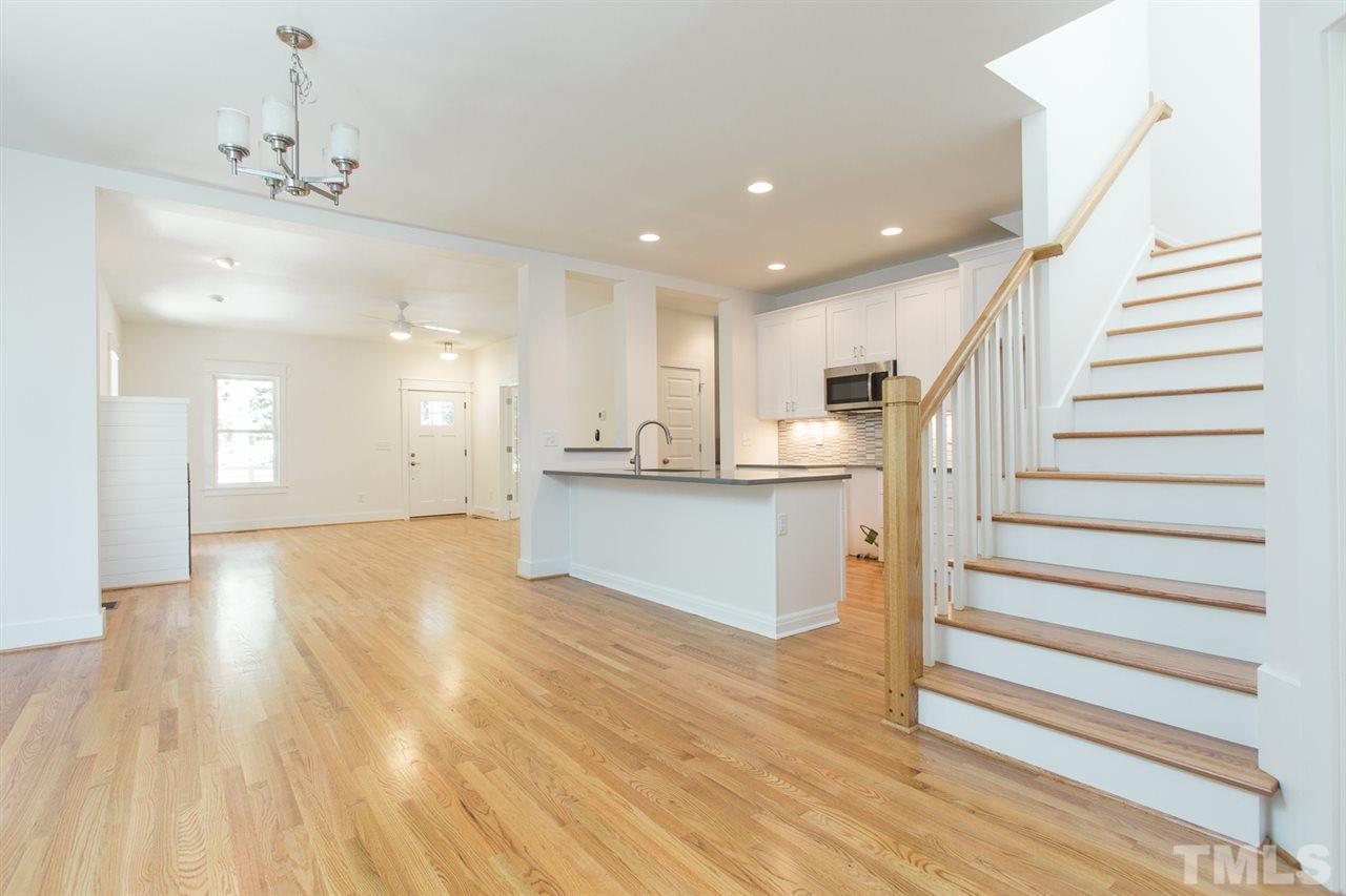 5316 Russell Road Durham, NC 27712 - Photo 7 of 25 a view of kitchen and hall with wooden floor