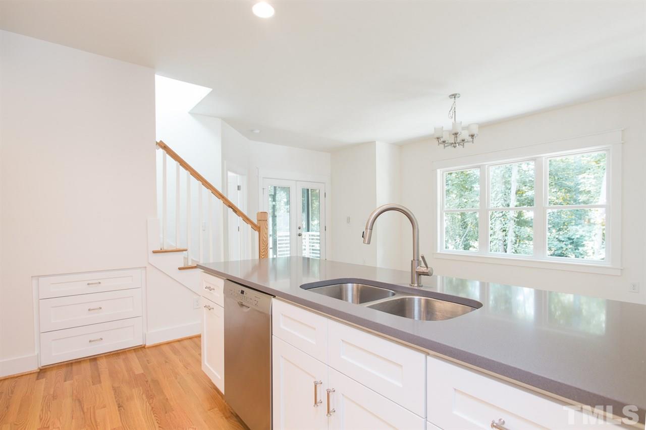 5316 Russell Road Durham, NC 27712 - Photo 9 of 25 a kitchen with a sink a counter top space and a window