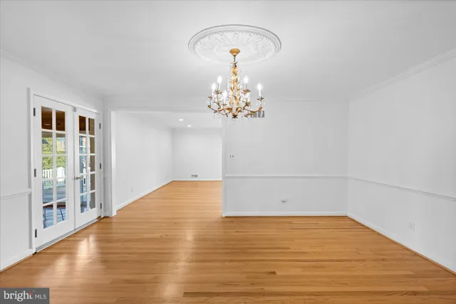 a kitchen with stainless steel appliances granite countertop a sink a stove and a wooden floors