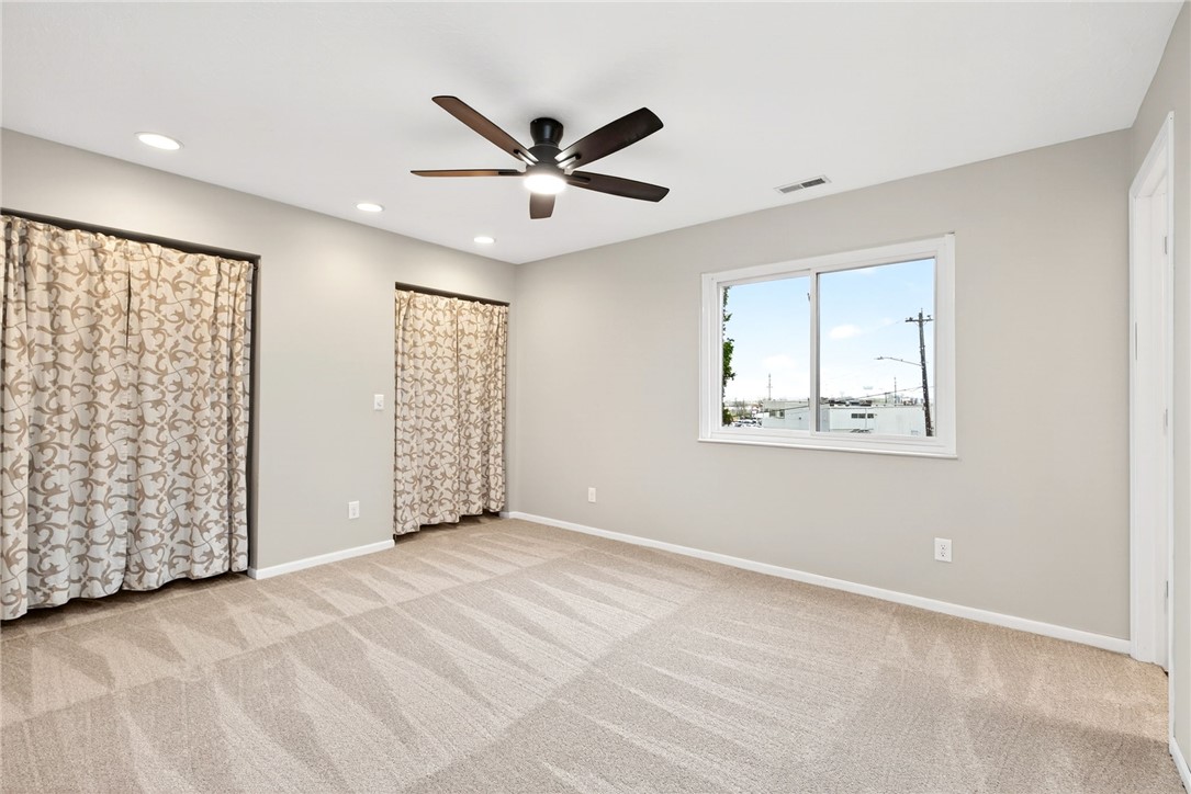3151 Roesch Boulevard, Unit 6 Fairfield, OH 45014 - Photo 19 of 29 This spacious bedroom offers ample natural light and comfortable carpeting, perfect for restful living.