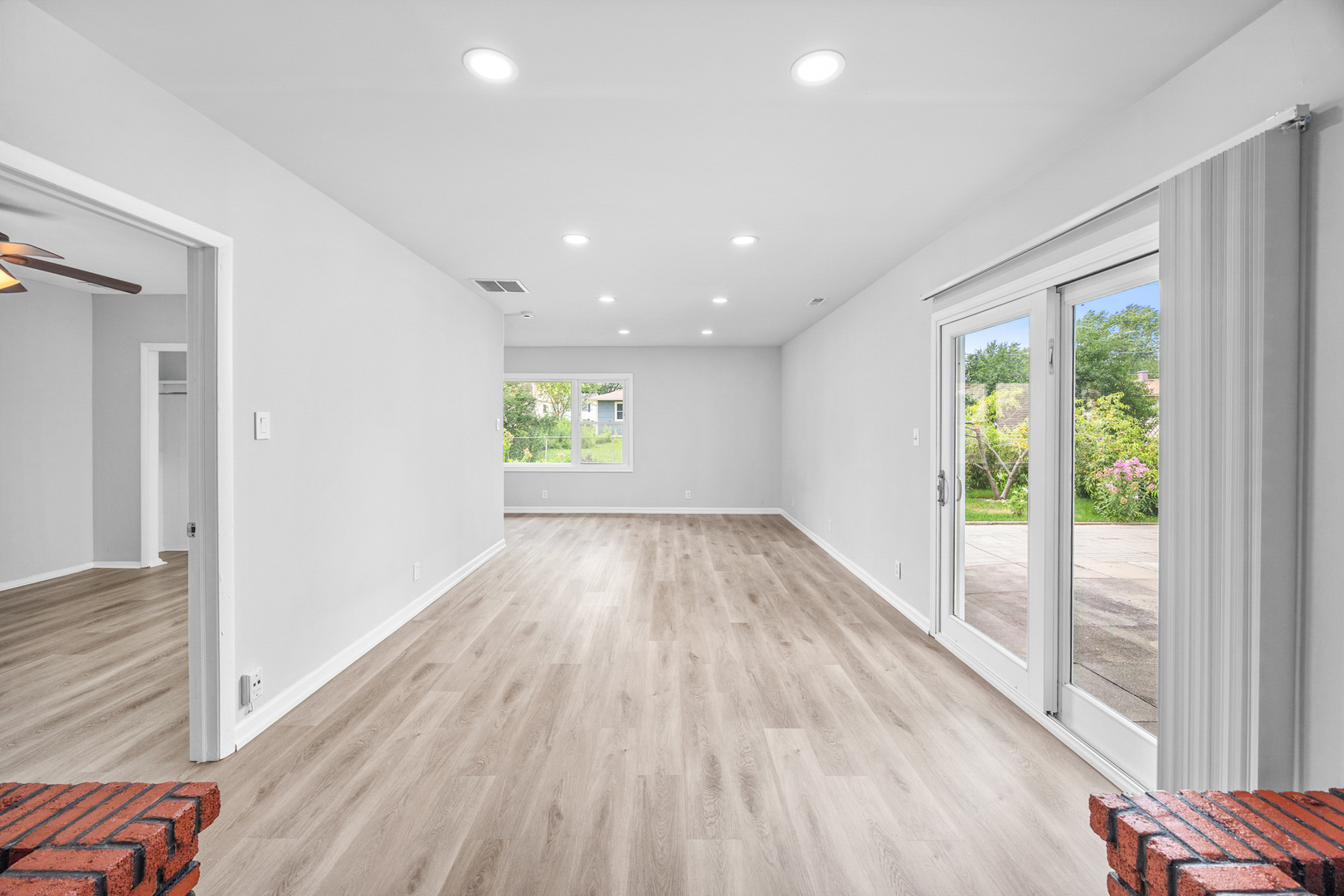 6640 Peach Tree Street Hanover Park, IL 60133 - Photo 12 of 27 wooden floor in an empty room with a window