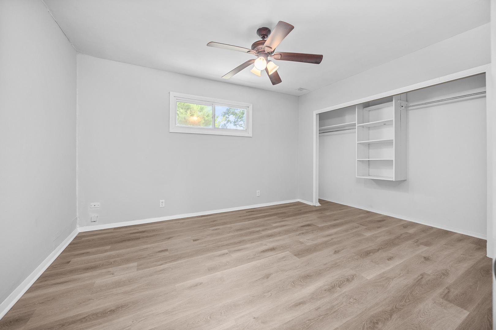 6640 Peach Tree Street Hanover Park, IL 60133 - Photo 13 of 27 a view of empty room with wooden floor