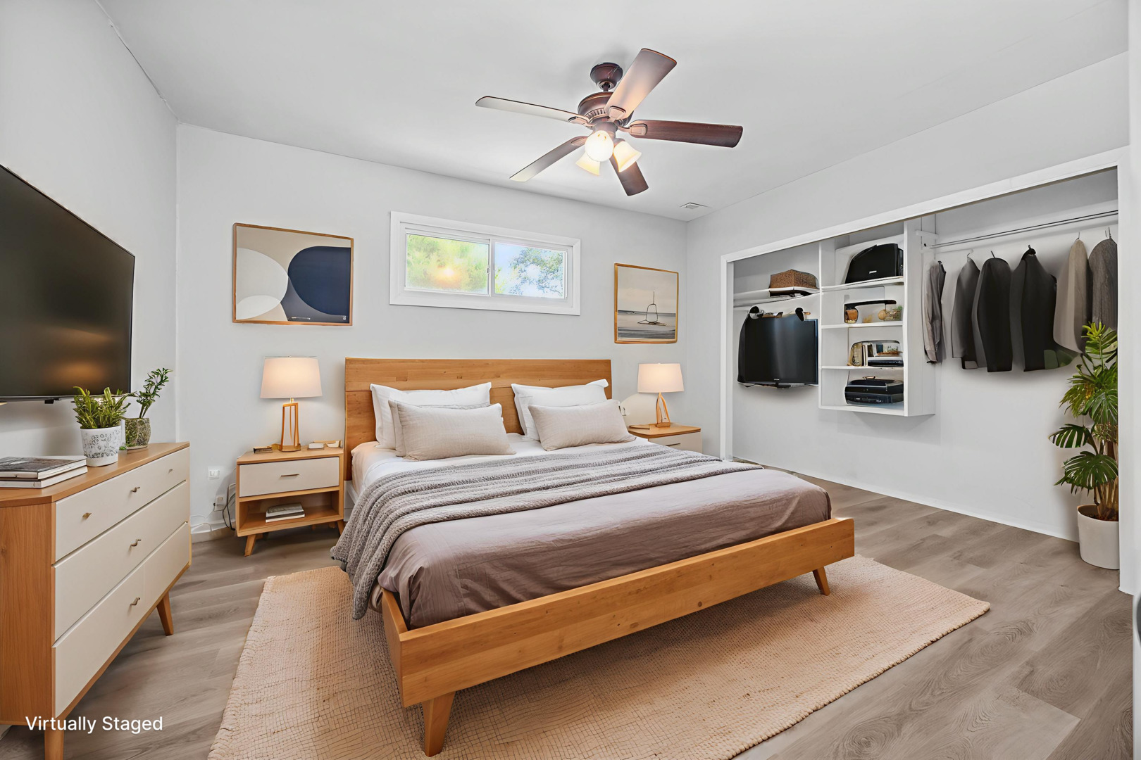 6640 Peach Tree Street Hanover Park, IL 60133 - Photo 14 of 27 a spacious bedroom with a bed and a flat screen tv
