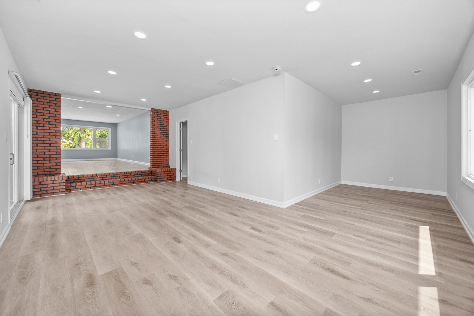 6640 Peach Tree Street Hanover Park, IL 60133 - Photo 15 of 27 a view of an empty room with window and wooden floor