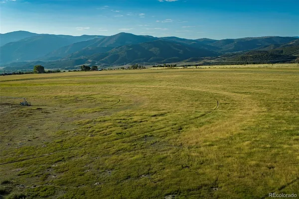 a view of an ocean and a mountain