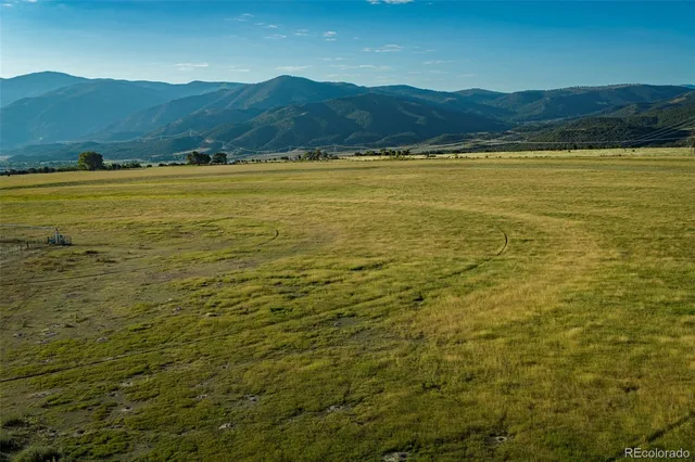 a view of an ocean and a mountain