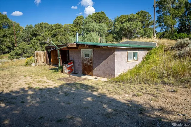 a view of a kitchen with appliances and a dining table